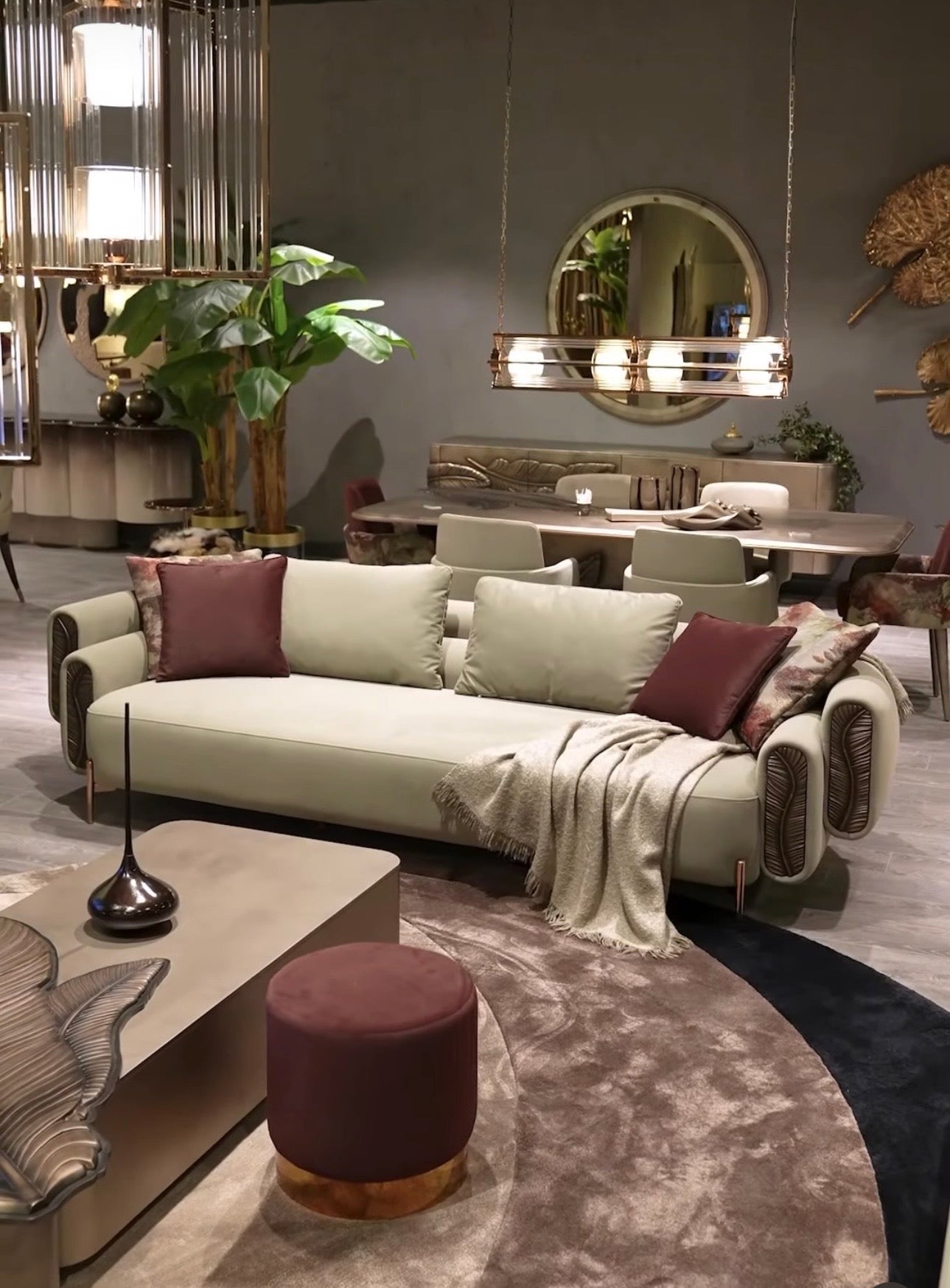 Blush luxury furniture collection featuring sculptural sofa, bronze leaf coffee table, modern dining set, and warm contemporary living room design.