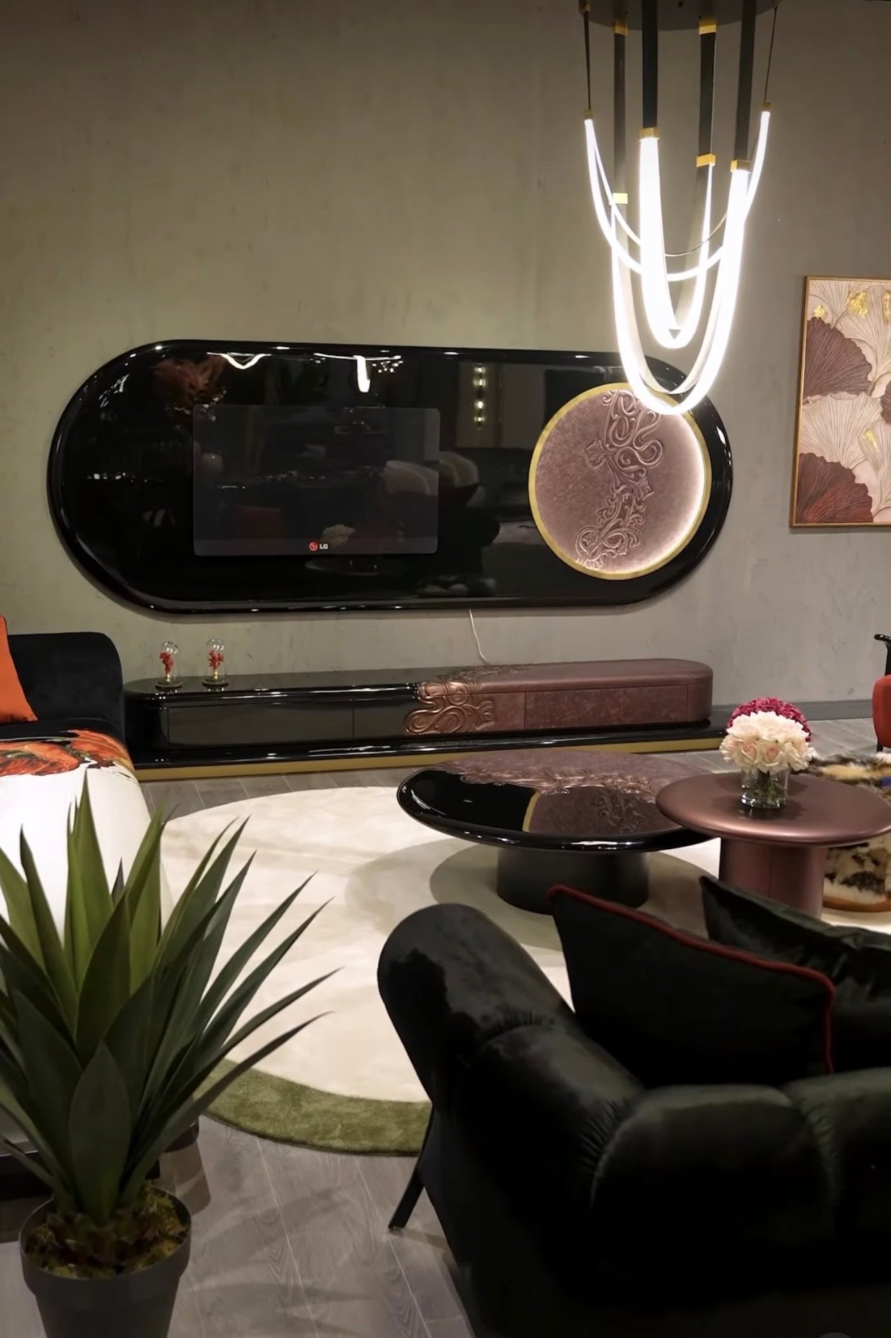 Noir luxury furniture collection with black velvet sofas, copper dining table, sculptural lighting, and dramatic modern interior styling.