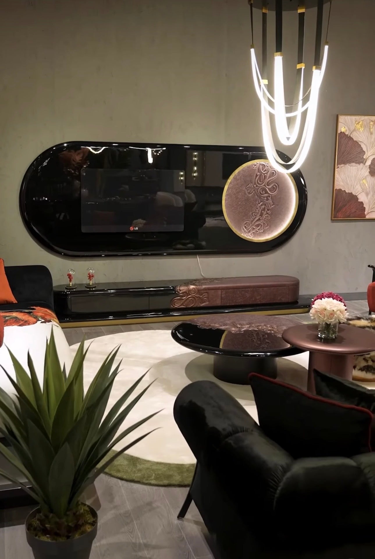 Noir luxury furniture collection with black velvet sofas, copper dining table, sculptural lighting, and dramatic modern interior styling.