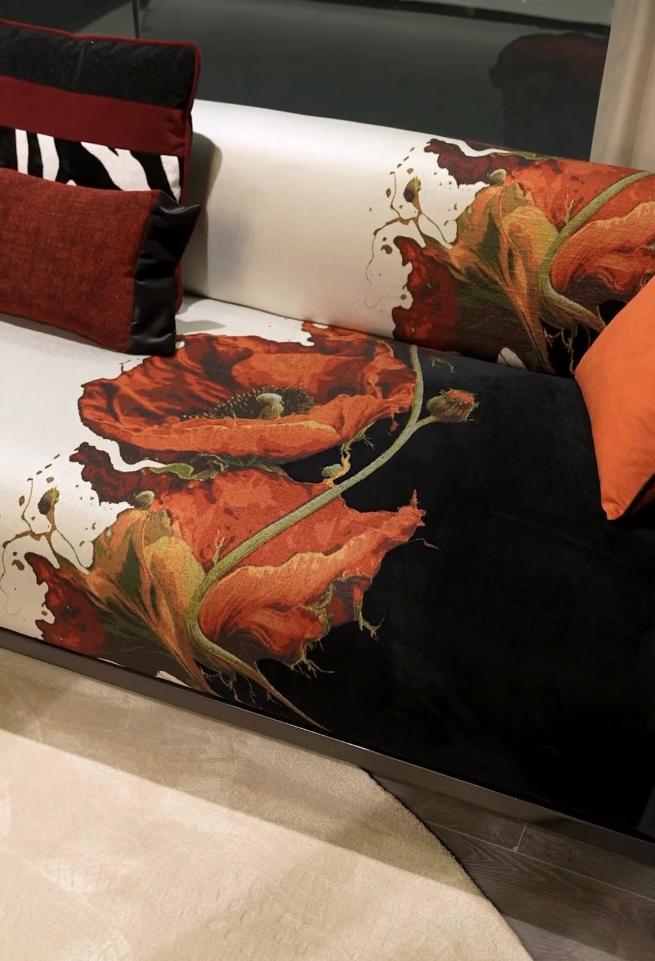 Noir luxury furniture collection with black velvet sofas, copper dining table, sculptural lighting, and dramatic modern interior styling.