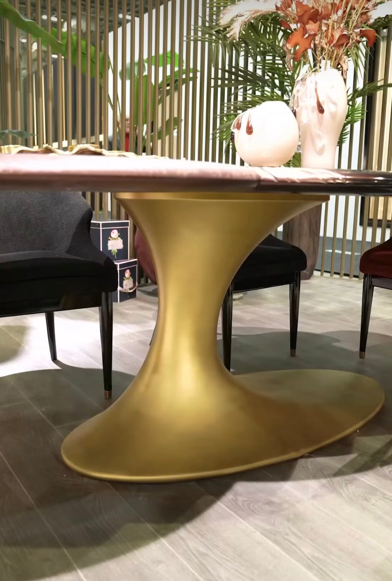 Noir luxury furniture collection with black velvet sofas, copper dining table, sculptural lighting, and dramatic modern interior styling.