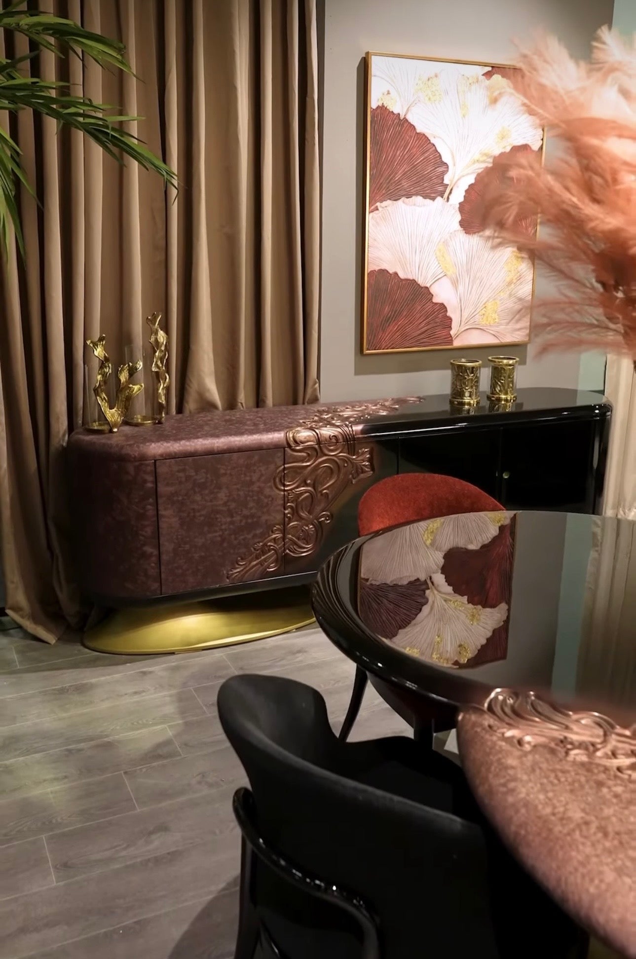 Noir luxury furniture collection with black velvet sofas, copper dining table, sculptural lighting, and dramatic modern interior styling.