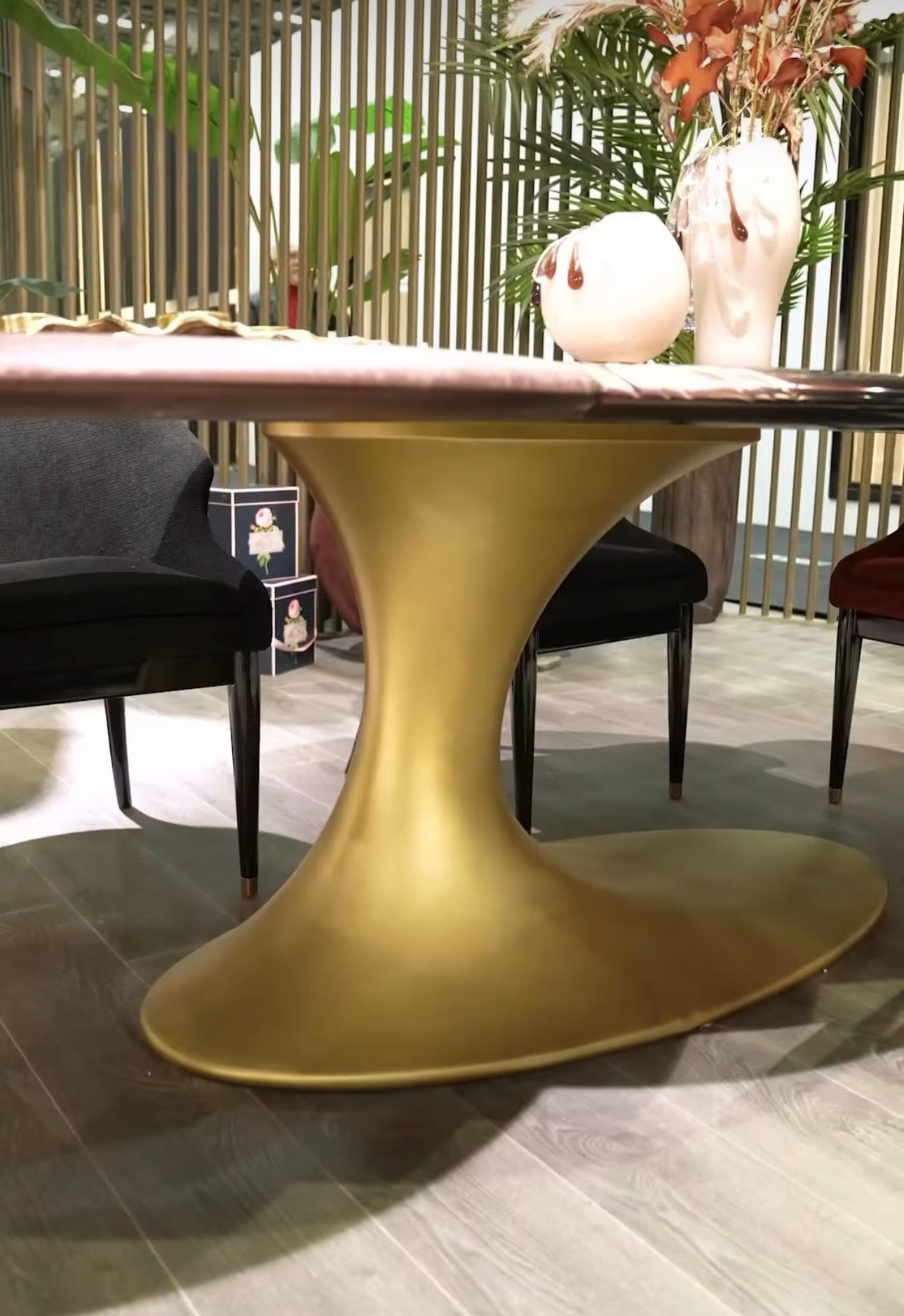 Noir luxury furniture collection with black velvet sofas, copper dining table, sculptural lighting, and dramatic modern interior styling.