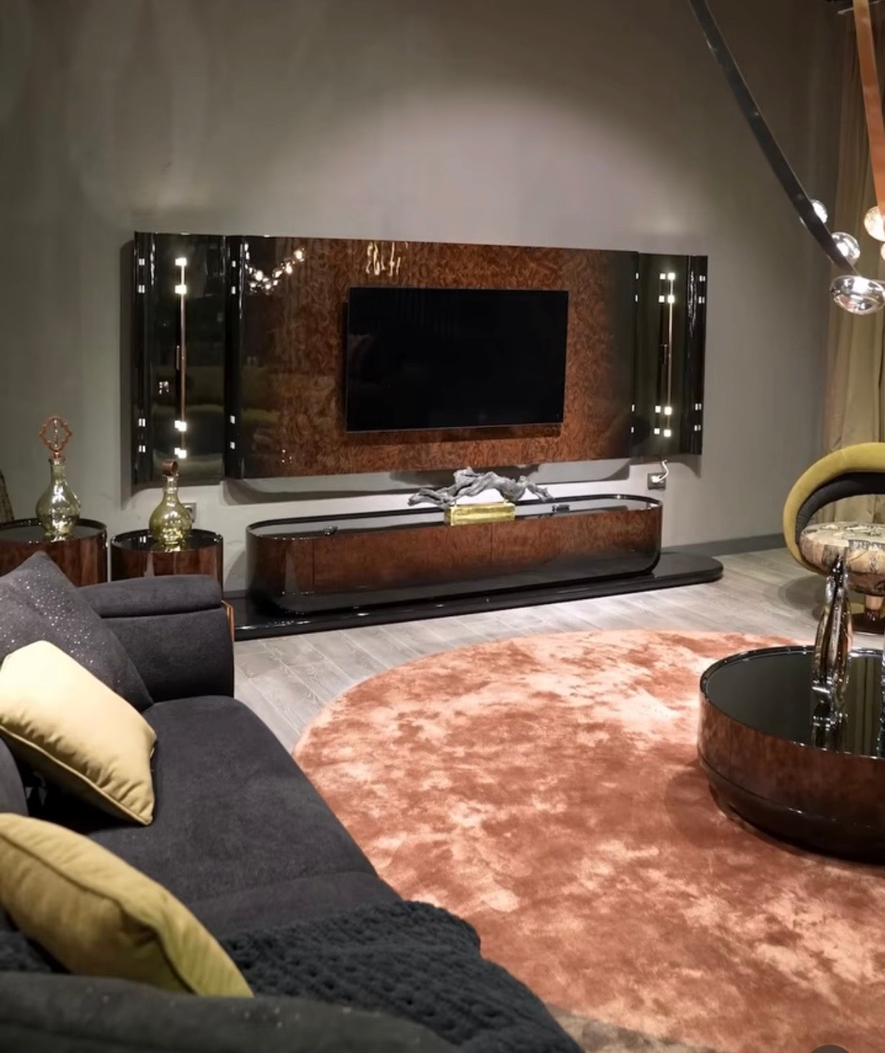 Inferno luxury furniture collection with curved sectional sofa, sculptural dining table, and artistic patterned upholstery.