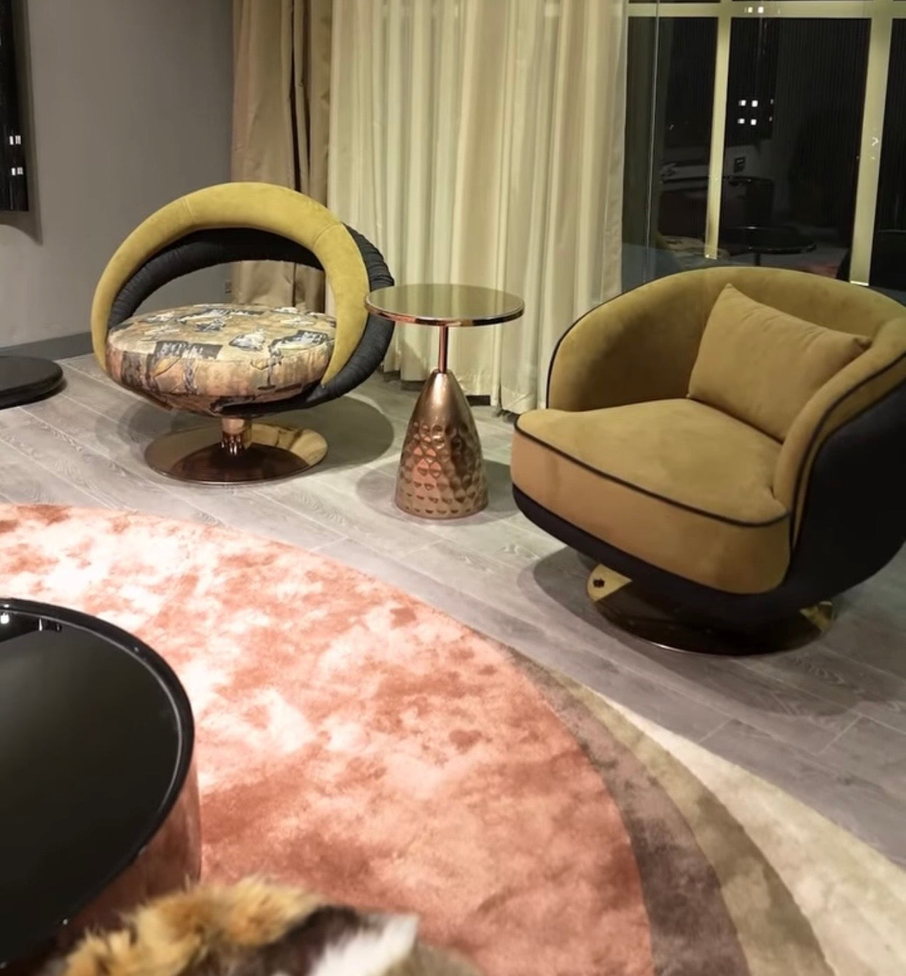 Inferno luxury furniture collection with curved sectional sofa, sculptural dining table, and artistic patterned upholstery.