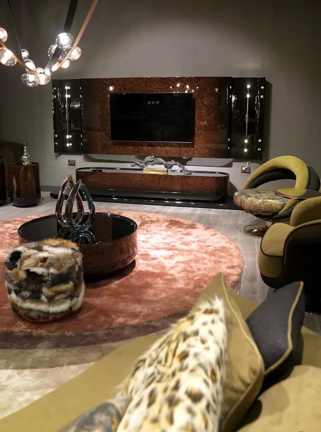 Inferno luxury furniture collection with curved sectional sofa, sculptural dining table, and artistic patterned upholstery.