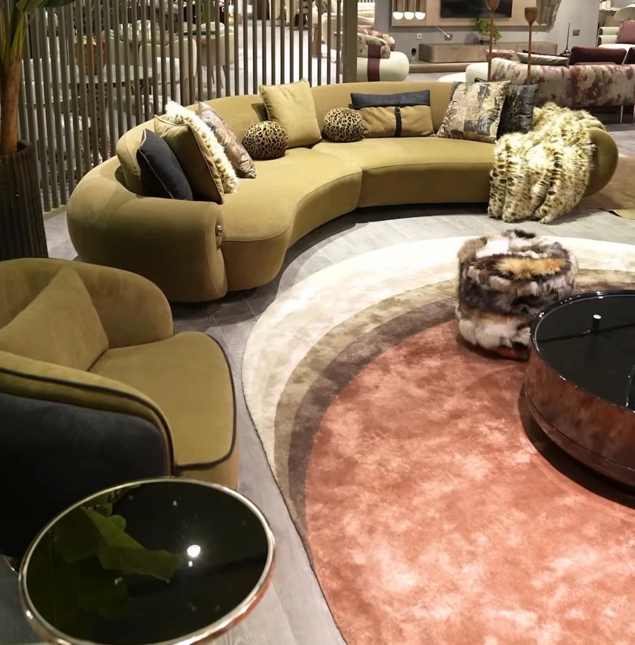 Inferno luxury furniture collection with curved sectional sofa, sculptural dining table, and artistic patterned upholstery.