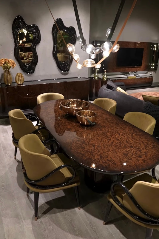 Inferno luxury furniture collection with curved sectional sofa, sculptural dining table, and artistic patterned upholstery.