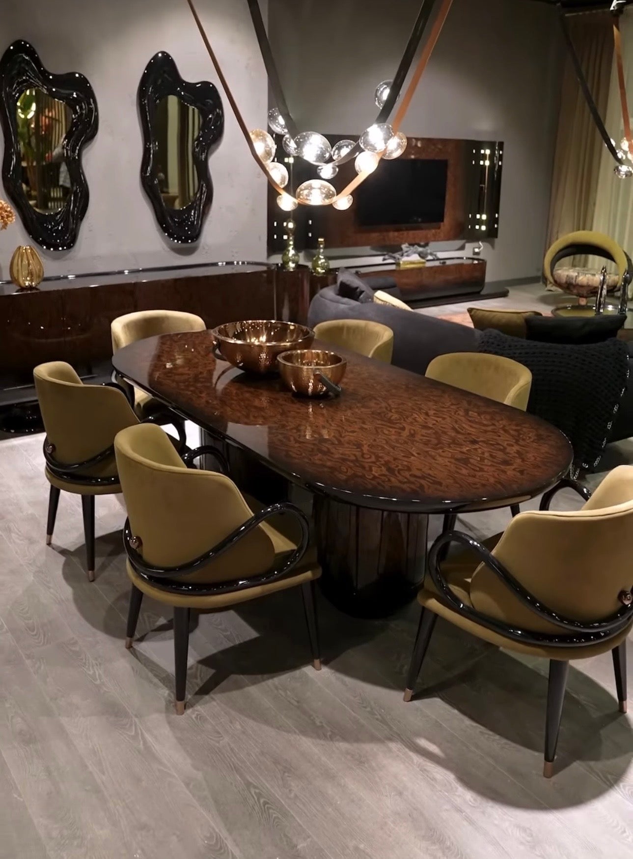 Inferno luxury furniture collection with curved sectional sofa, sculptural dining table, and artistic patterned upholstery.