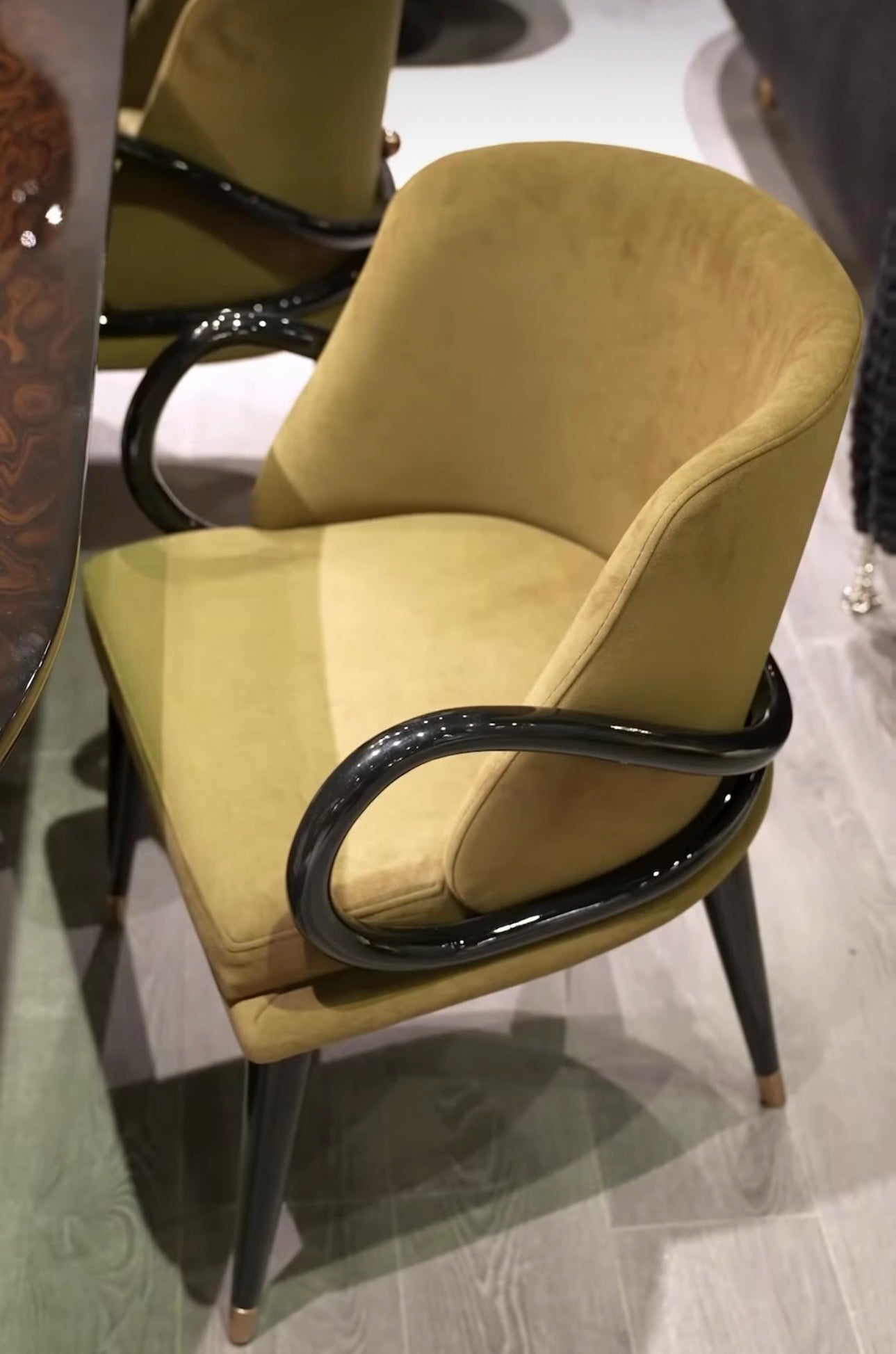 Inferno luxury furniture collection with curved sectional sofa, sculptural dining table, and artistic patterned upholstery.