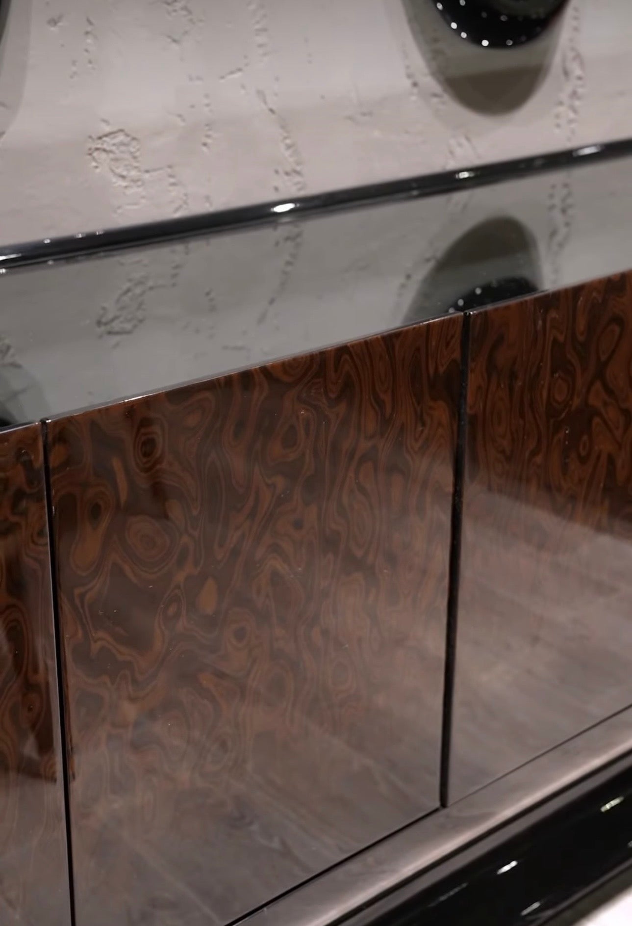 Inferno luxury furniture collection with curved sectional sofa, sculptural dining table, and artistic patterned upholstery.