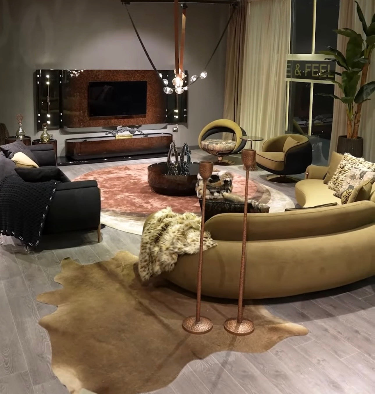 Inferno luxury furniture collection with curved sectional sofa, sculptural dining table, and artistic patterned upholstery.