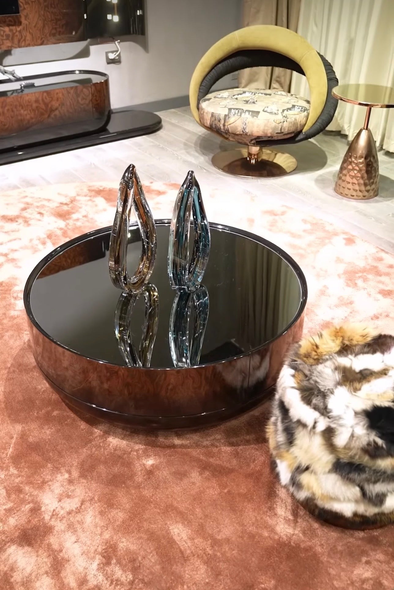 Inferno luxury furniture collection with curved sectional sofa, sculptural dining table, and artistic patterned upholstery.