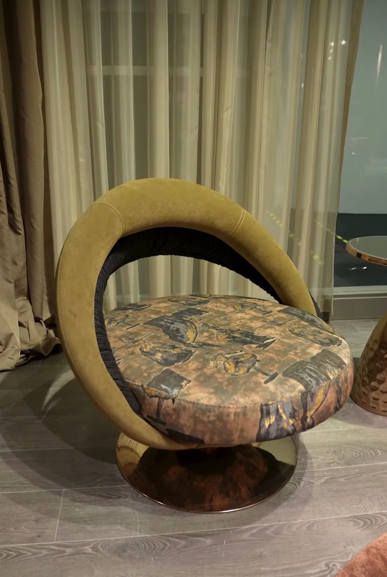 Inferno luxury furniture collection with curved sectional sofa, sculptural dining table, and artistic patterned upholstery.