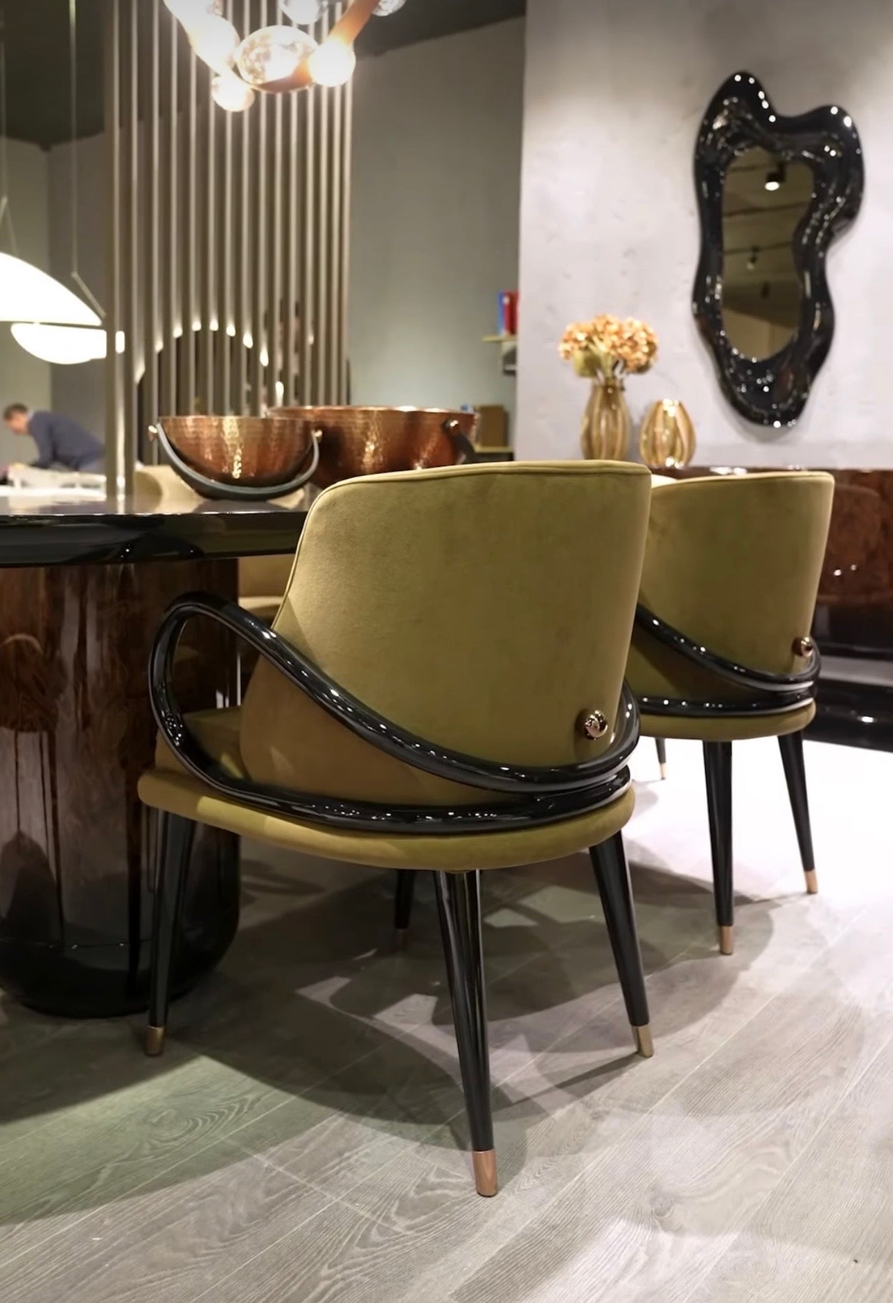 Inferno luxury furniture collection with curved sectional sofa, sculptural dining table, and artistic patterned upholstery.