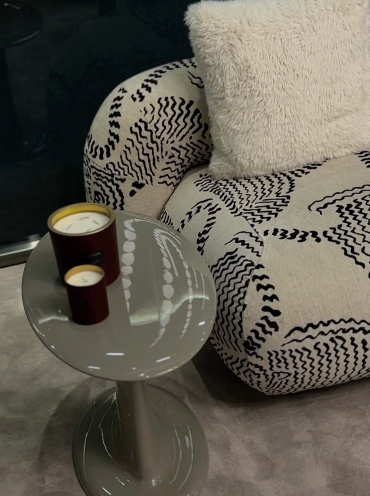 Lowlight modern lacquer furniture collection with sculptural orange sideboard, statement coffee tables, and contemporary dining design.