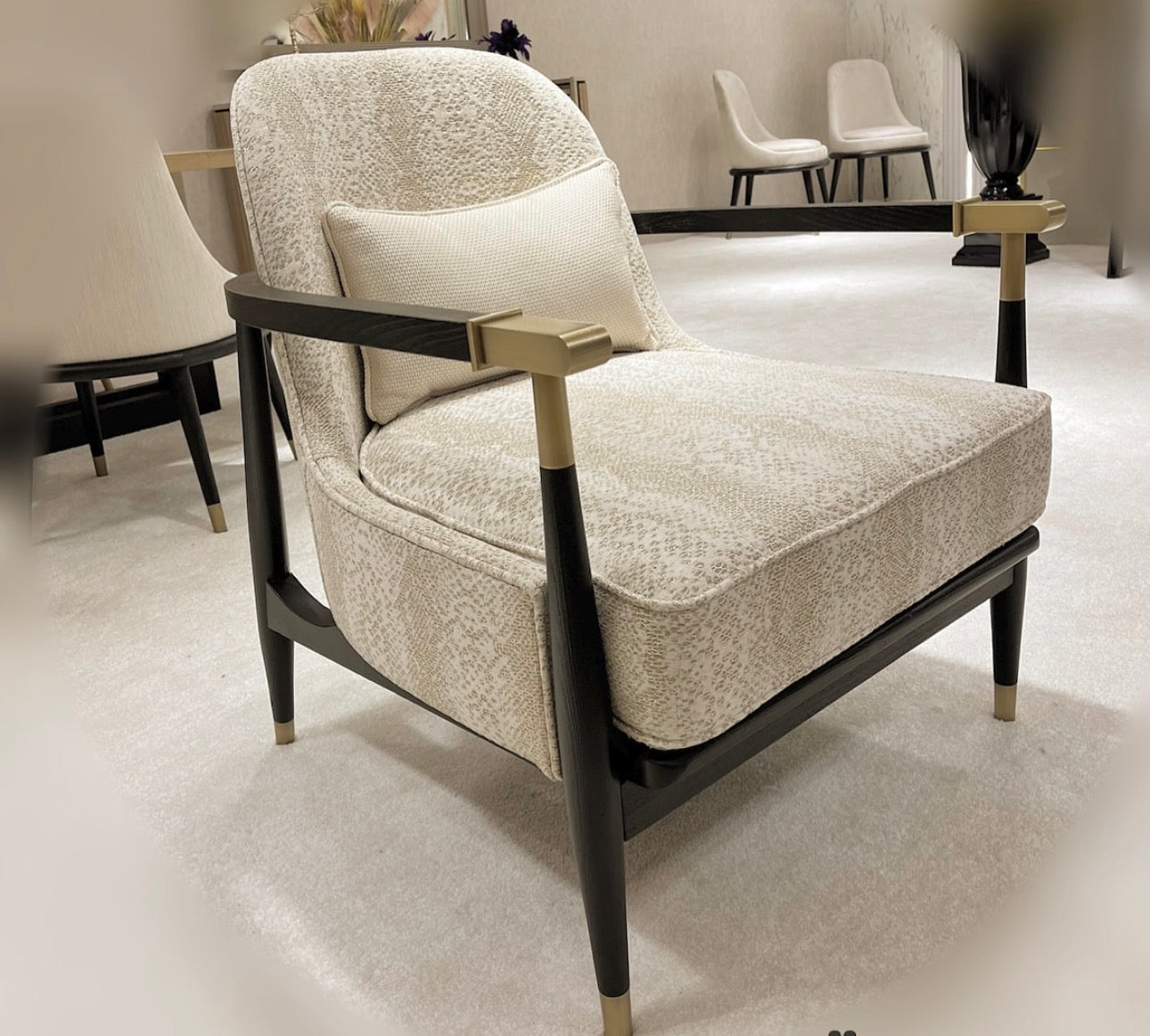 Roux luxury furniture collection featuring modern neutral bedroom set, elegant vanity console, and contemporary accent chair with black and gold details.