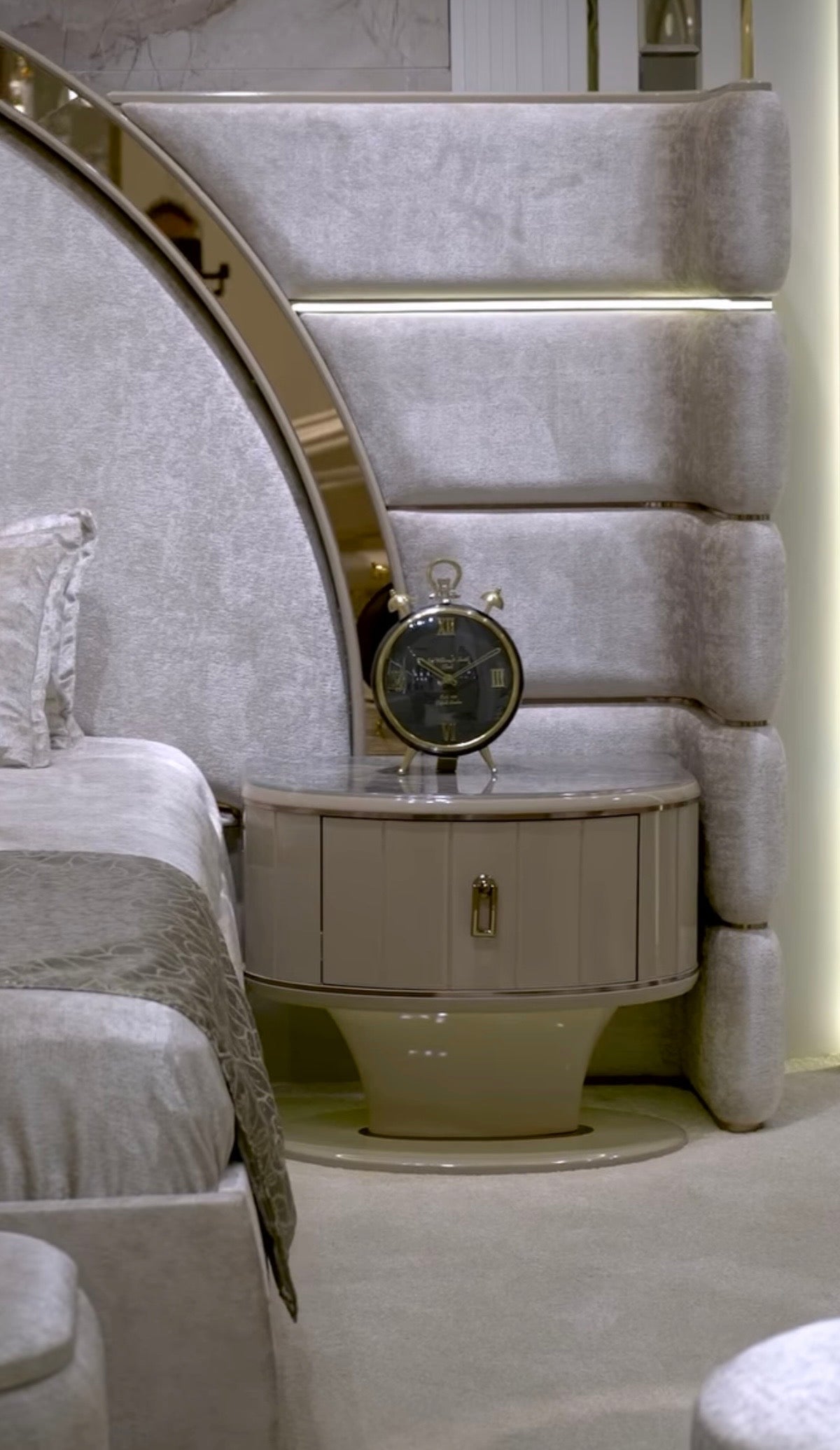 Crown luxury modern bedroom furniture collection with arched statement bed, marble dining table, mirrored wardrobe, and sculptural vanity.