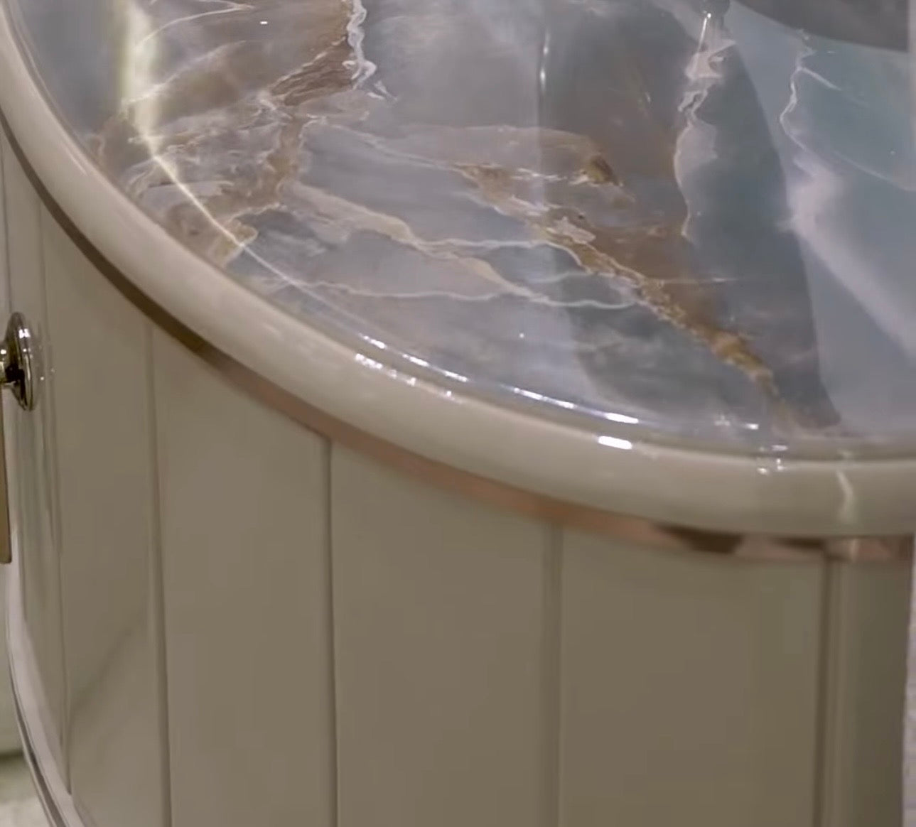 Crown luxury modern bedroom furniture collection with arched statement bed, marble dining table, mirrored wardrobe, and sculptural vanity.