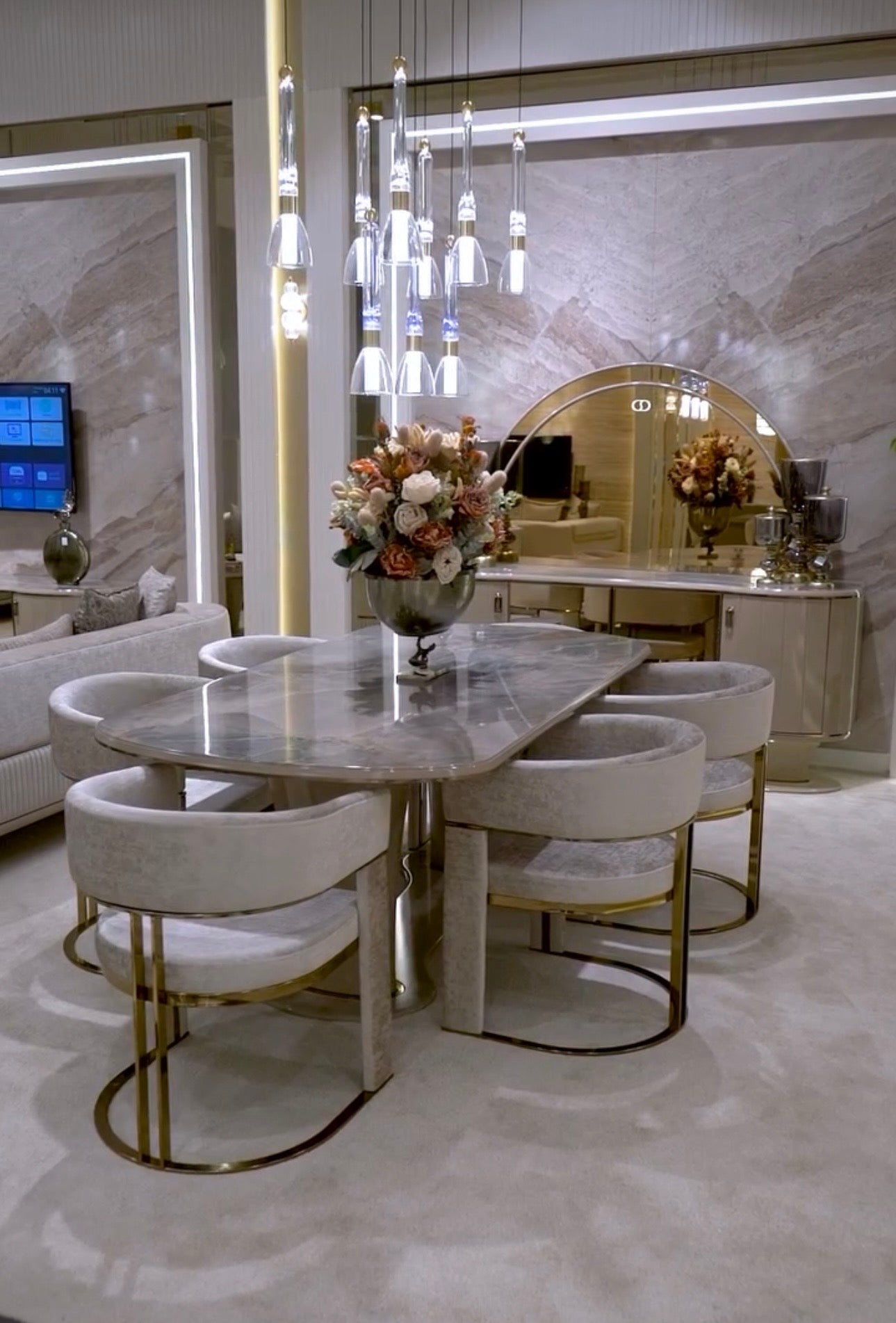 Crown luxury modern bedroom furniture collection with arched statement bed, marble dining table, mirrored wardrobe, and sculptural vanity.