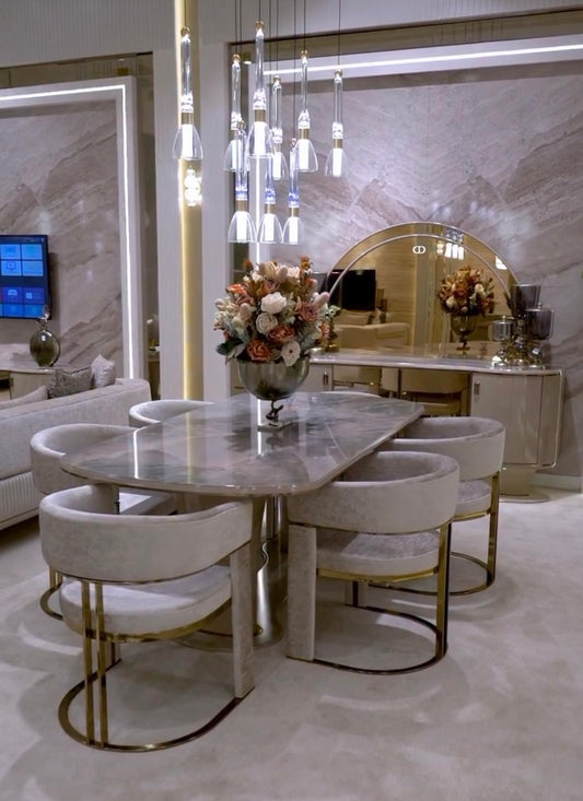 Crown luxury modern bedroom furniture collection with arched statement bed, marble dining table, mirrored wardrobe, and sculptural vanity.