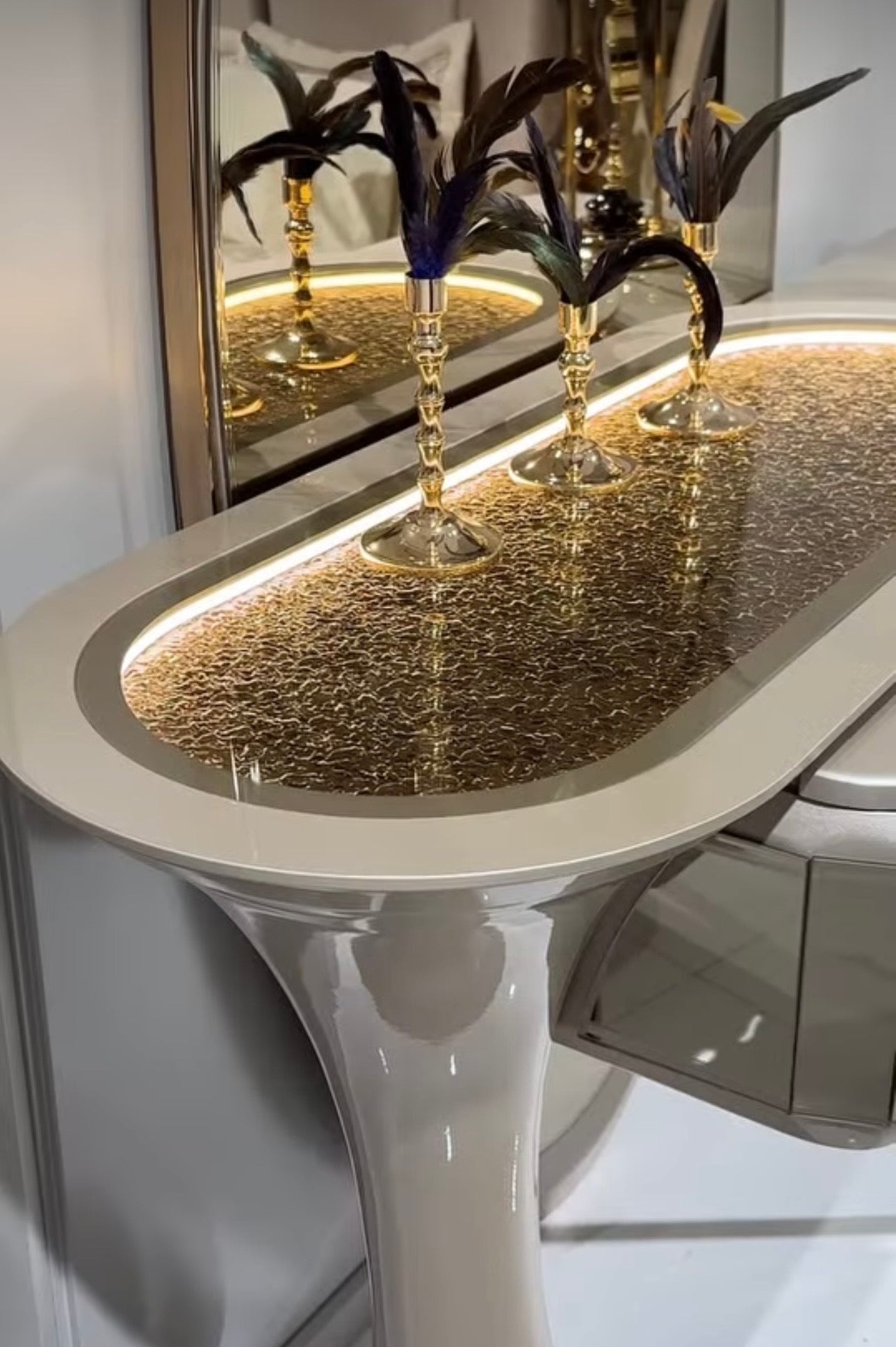 Heiroom luxury modern bedroom furniture collection with sculptural upholstered bed, mirrored console, and elegant vanity design.