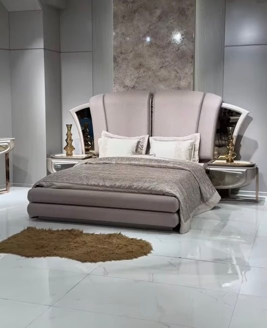 Heiroom luxury modern bedroom furniture collection with sculptural upholstered bed, mirrored console, and elegant vanity design.