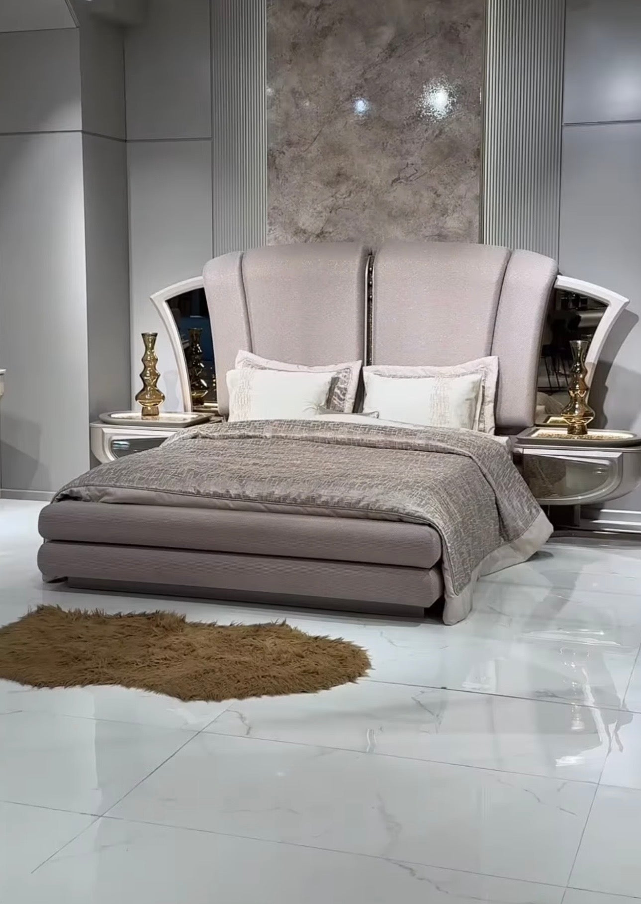 Heiroom luxury modern bedroom furniture collection with sculptural upholstered bed, mirrored console, and elegant vanity design.