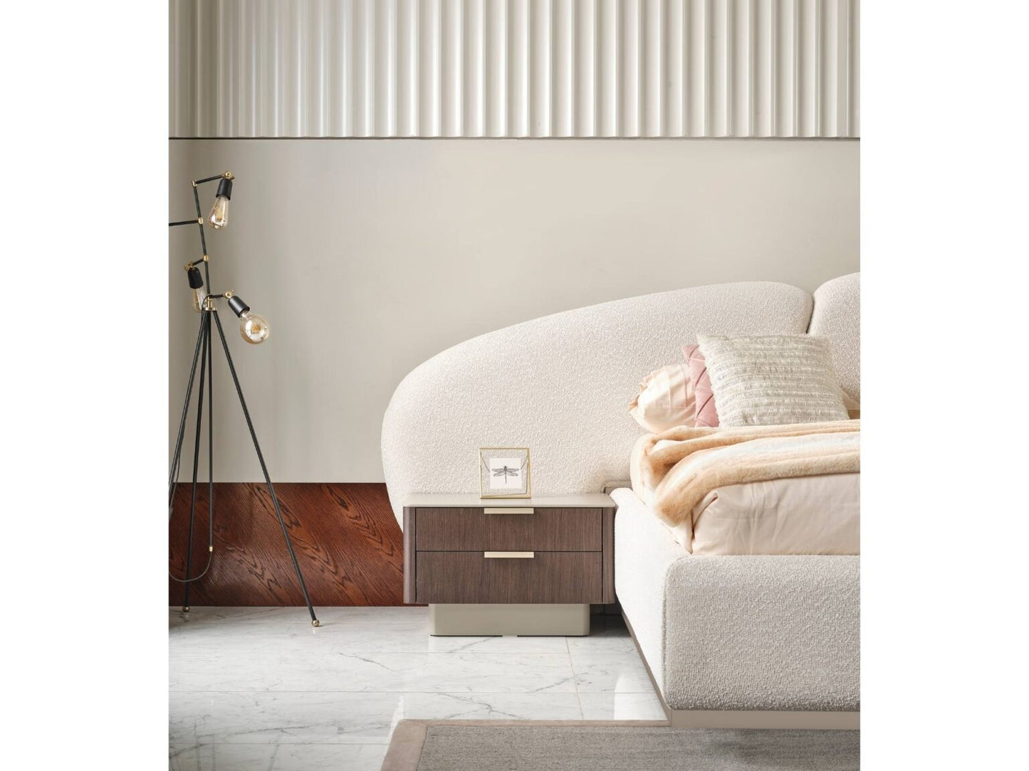 Terrae modern luxury bedroom collection featuring upholstered bed, sculptural mirror vanity, and warm wood bedside tables in a serene minimalist space.