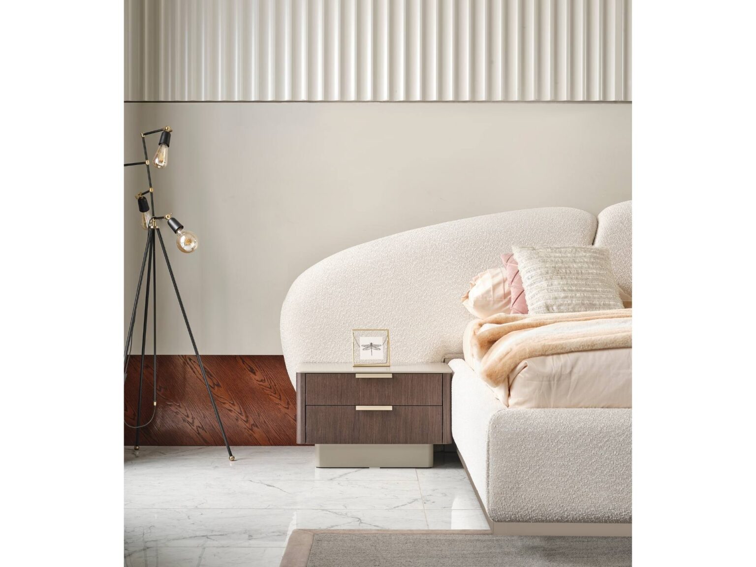 Terrae modern luxury bedroom collection featuring upholstered bed, sculptural mirror vanity, and warm wood bedside tables in a serene minimalist space.