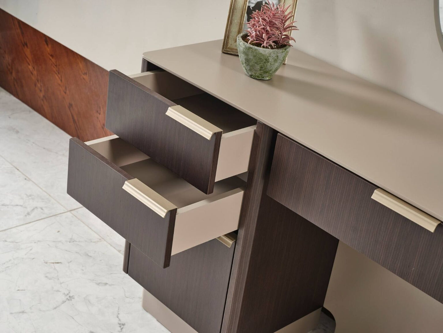 Terrae modern luxury bedroom collection featuring upholstered bed, sculptural mirror vanity, and warm wood bedside tables in a serene minimalist space.