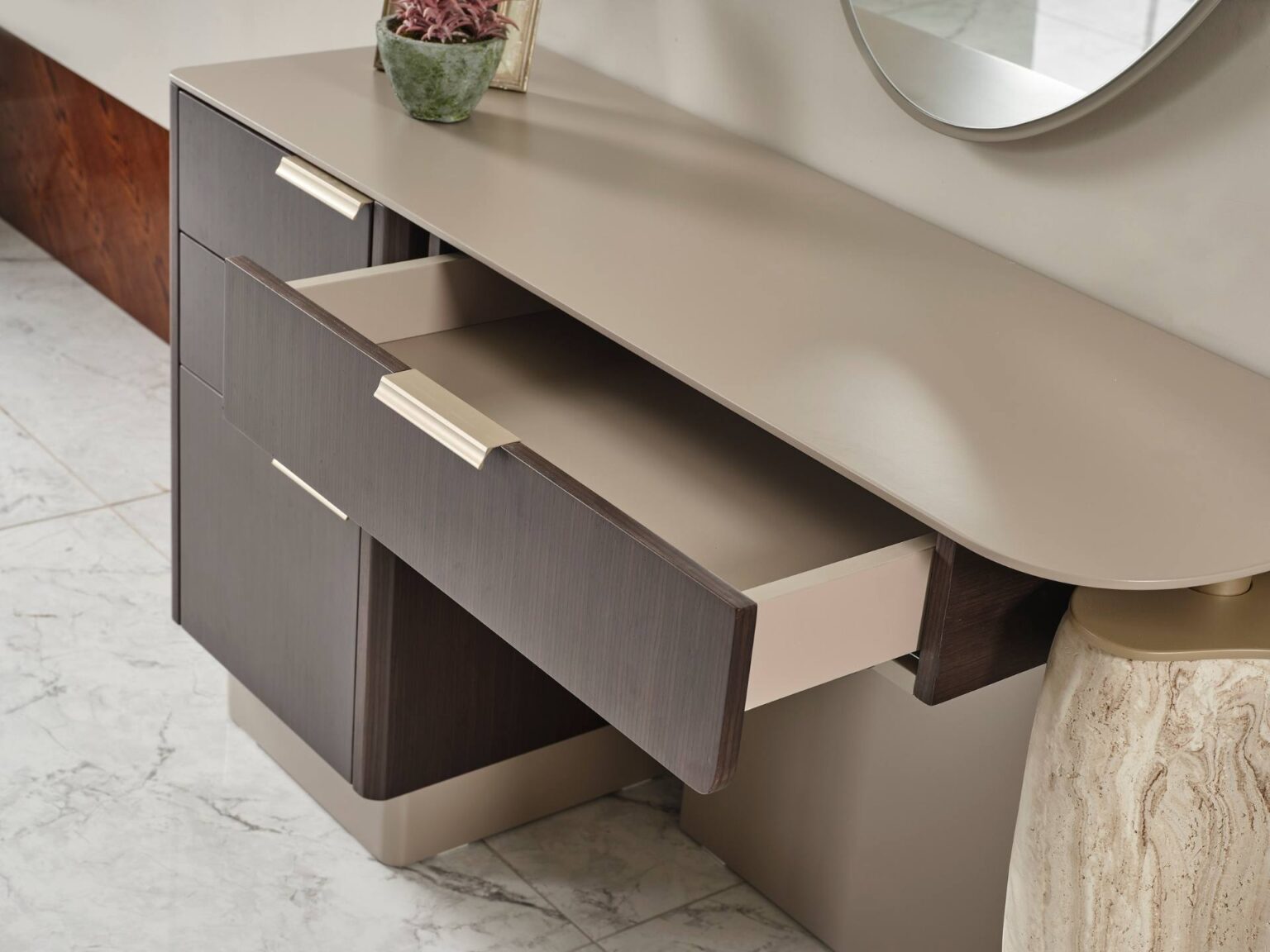 Terrae modern luxury bedroom collection featuring upholstered bed, sculptural mirror vanity, and warm wood bedside tables in a serene minimalist space.