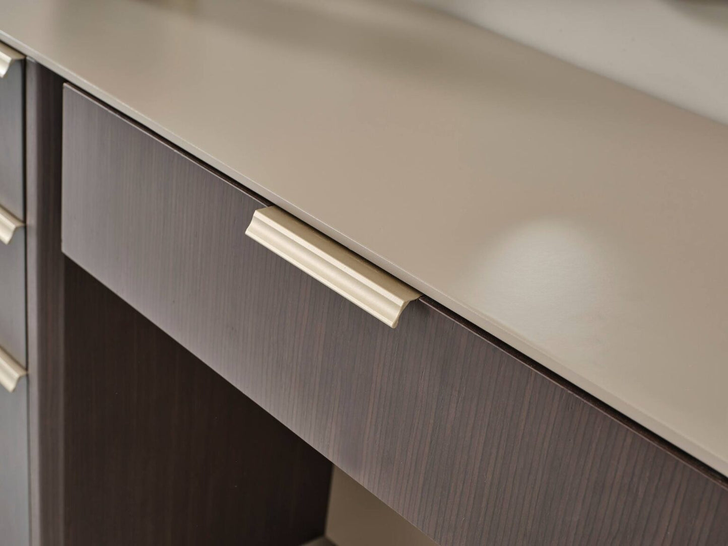 Terrae modern luxury bedroom collection featuring upholstered bed, sculptural mirror vanity, and warm wood bedside tables in a serene minimalist space.