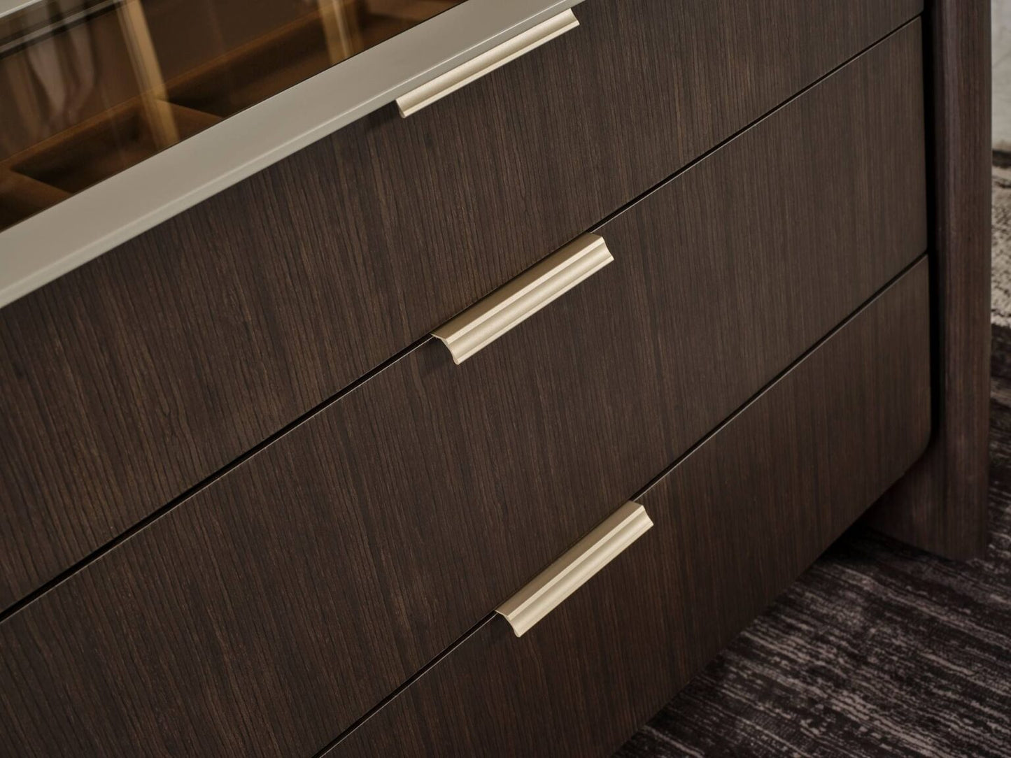 Terrae modern luxury bedroom collection featuring upholstered bed, sculptural mirror vanity, and warm wood bedside tables in a serene minimalist space.