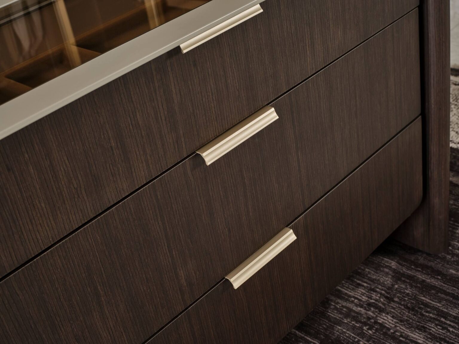 Terrae modern luxury bedroom collection featuring upholstered bed, sculptural mirror vanity, and warm wood bedside tables in a serene minimalist space.