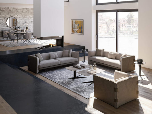 Ledger modern luxury living room furniture with tailored sofas, lounge chairs, and minimalist coffee tables in a contemporary interior.