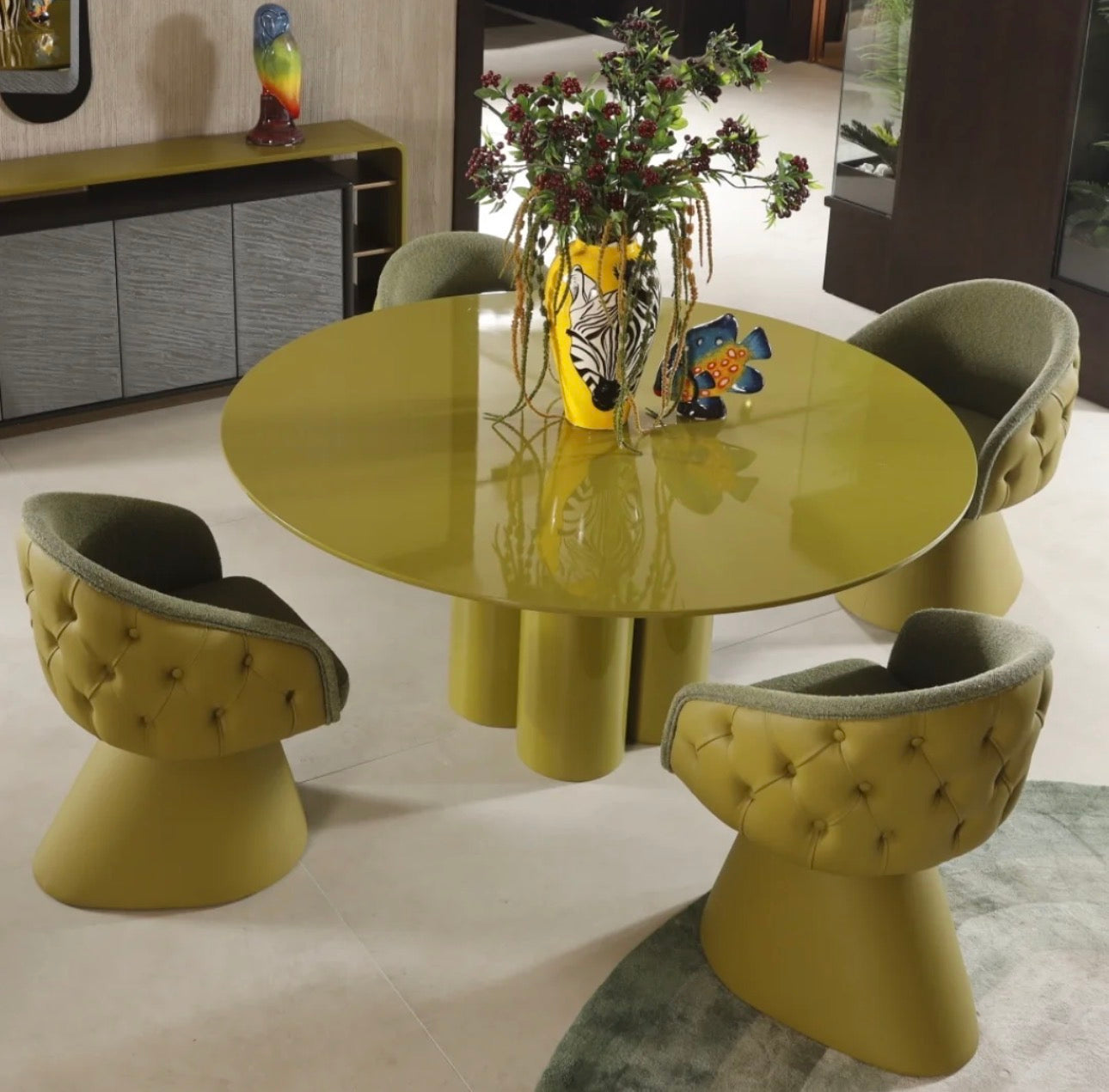 Honey modern luxury dining furniture collection with sculptural green dining table and tufted pedestal dining chairs.