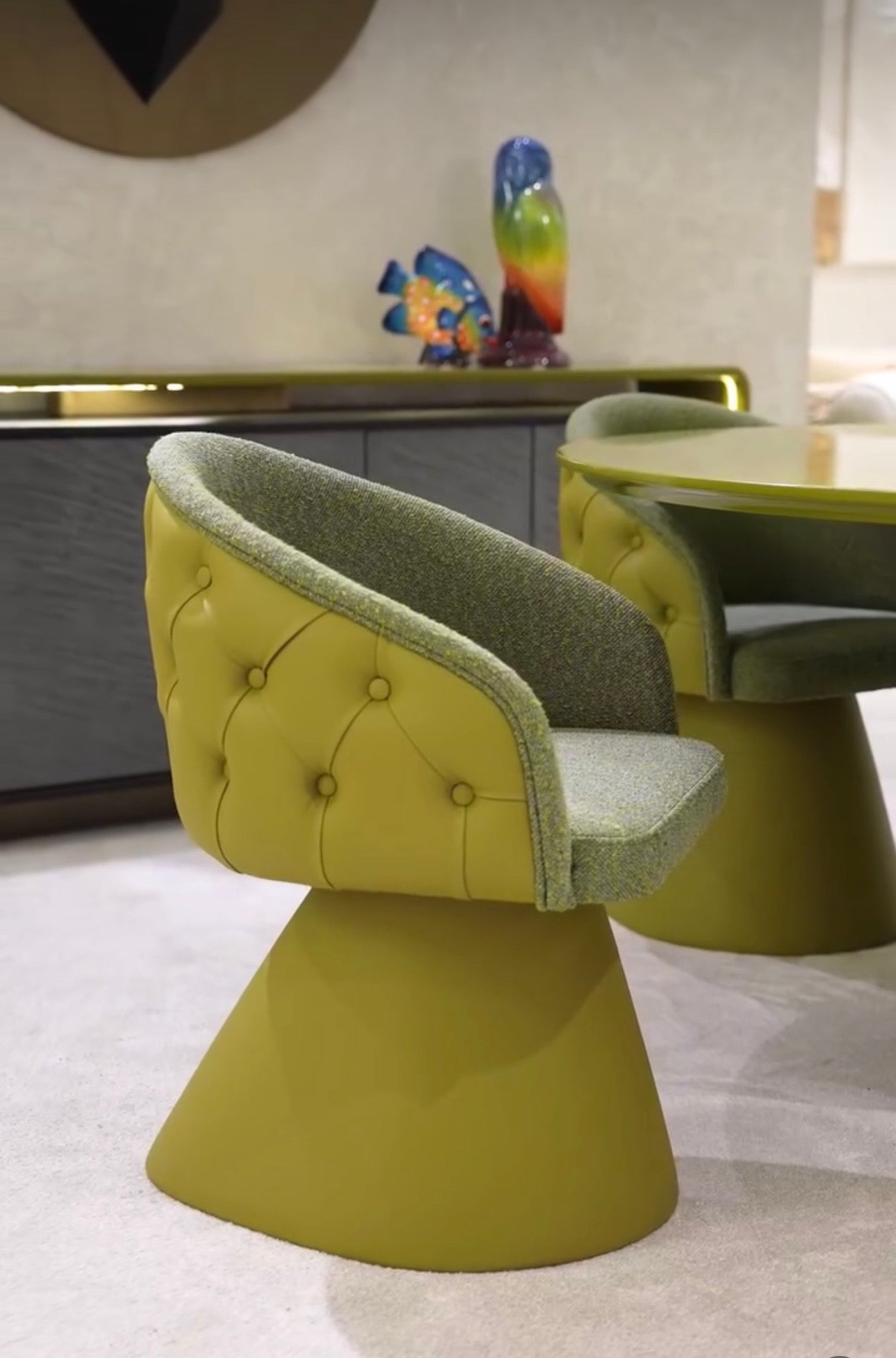 Honey modern luxury dining furniture collection with sculptural green dining table and tufted pedestal dining chairs.