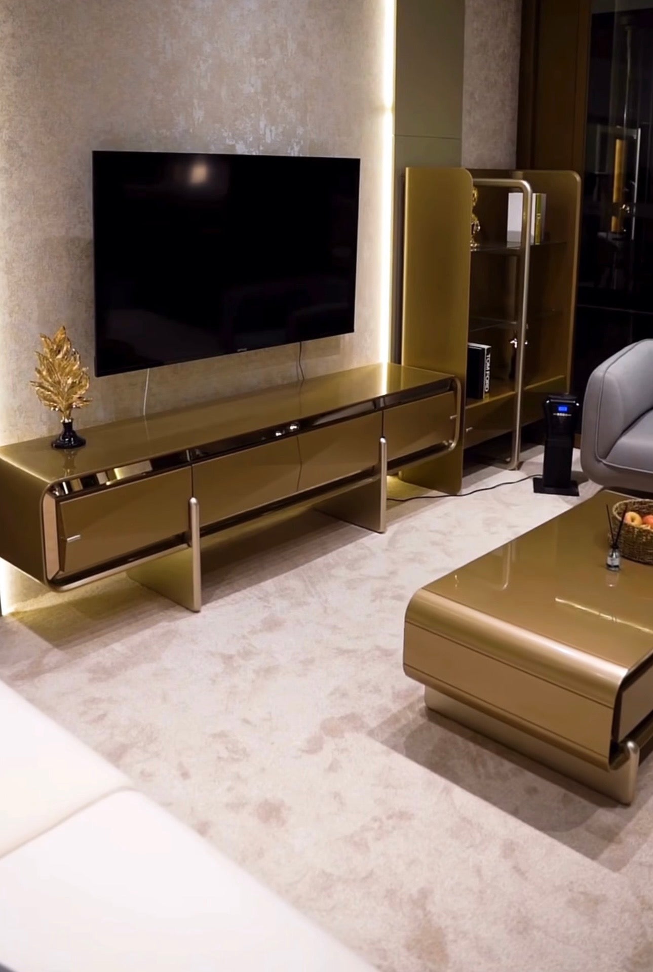 Aurelius luxury furniture collection with sculptural console, modern mirror, and metallic accent cabinetry.