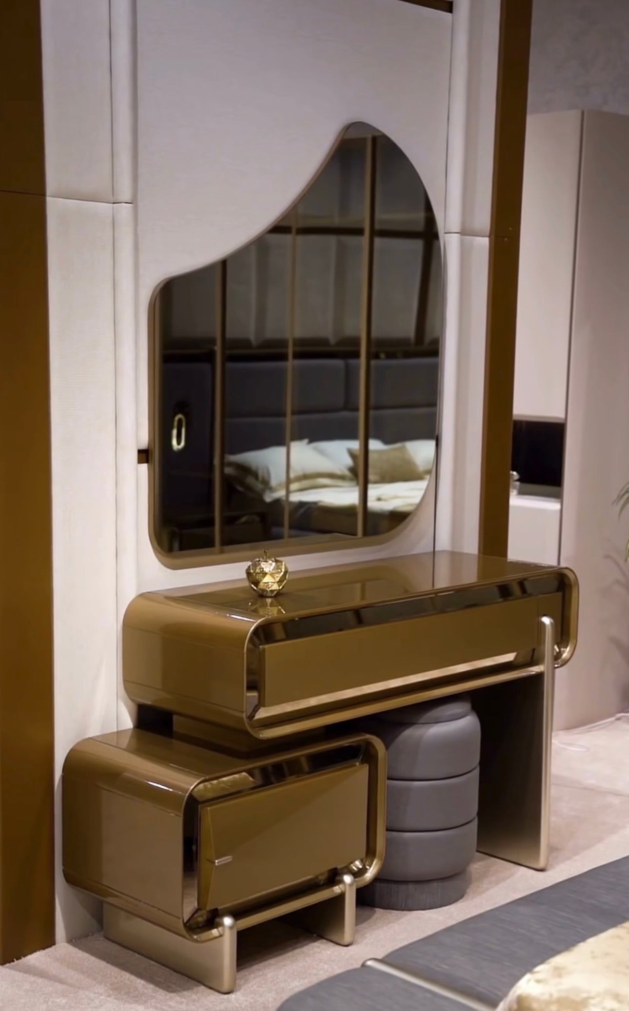 Aurelius luxury furniture collection with sculptural console, modern mirror, and metallic accent cabinetry.