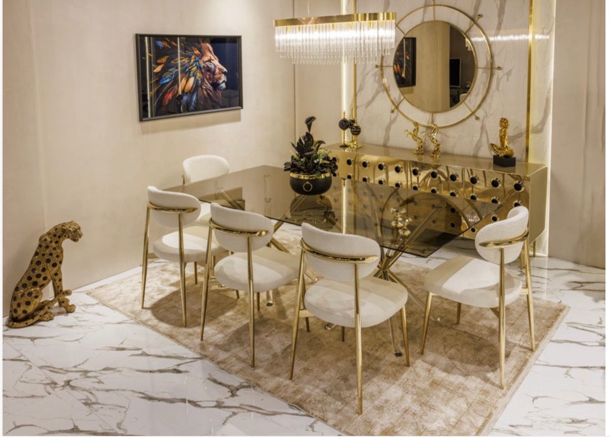 Ivory luxury furniture collection with gold sideboard, marble walls, white seating, and modern high-end living and dining design.