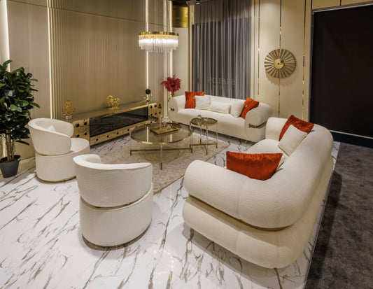 Ivory luxury furniture collection with gold sideboard, marble walls, white seating, and modern high-end living and dining design.