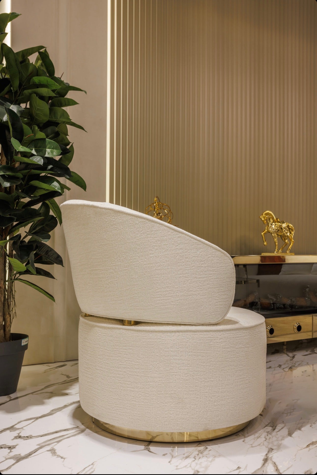 Ivory luxury furniture collection with gold sideboard, marble walls, white seating, and modern high-end living and dining design.