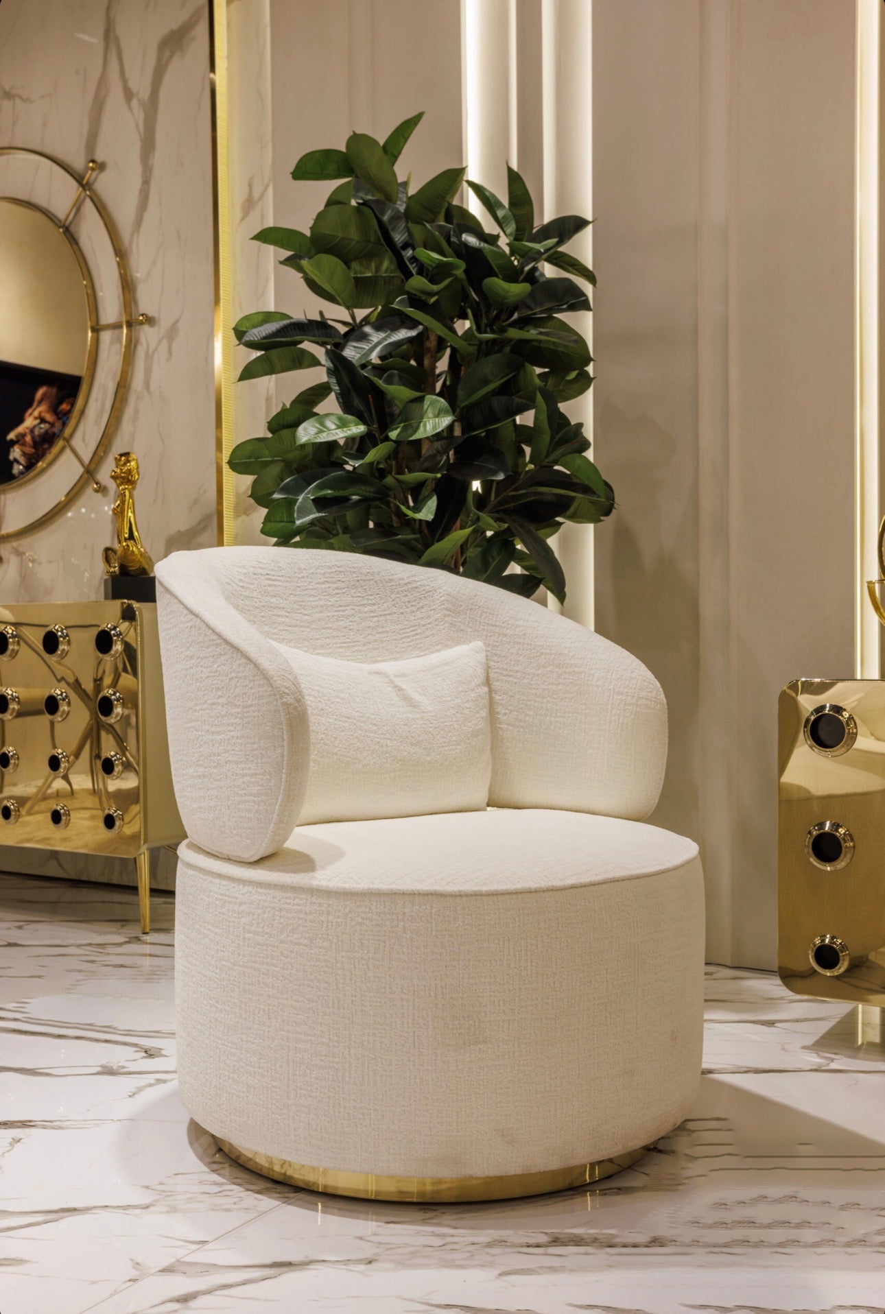 Ivory luxury furniture collection with gold sideboard, marble walls, white seating, and modern high-end living and dining design.