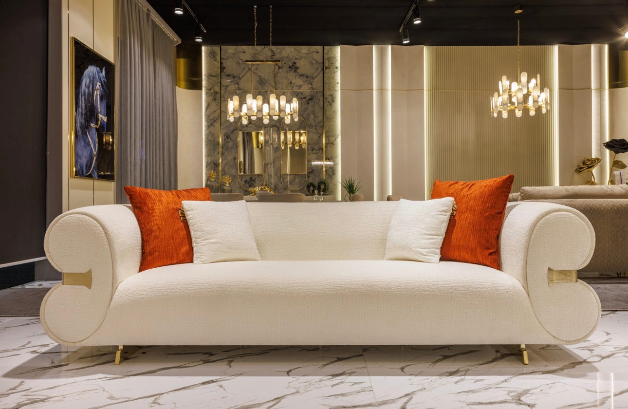 Ivory luxury furniture collection with gold sideboard, marble walls, white seating, and modern high-end living and dining design.