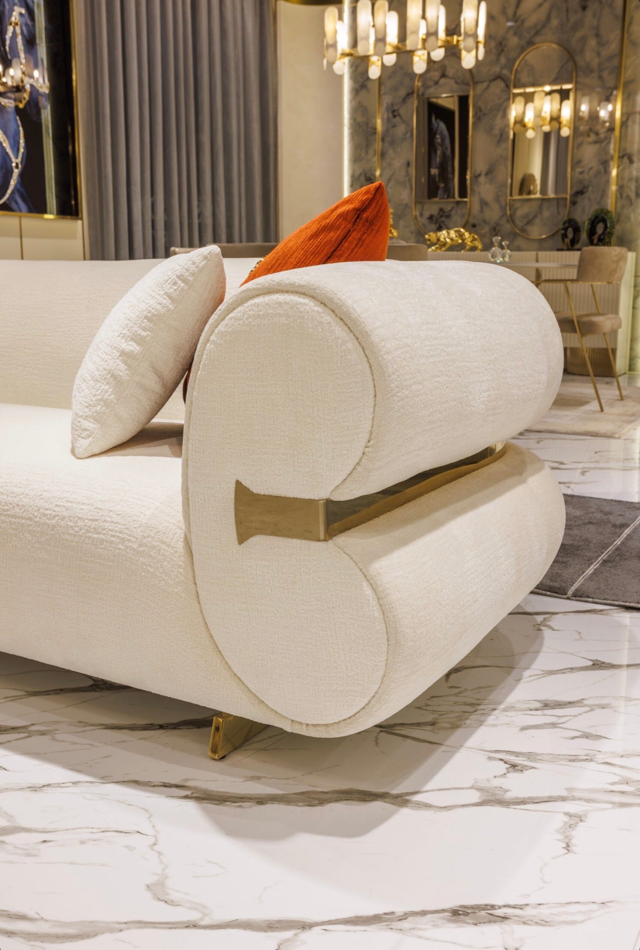 Ivory luxury furniture collection with gold sideboard, marble walls, white seating, and modern high-end living and dining design.