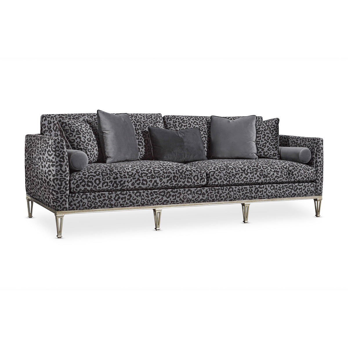 Panthera luxury furniture collection featuring statement sofa, sculptural coffee table, pedestal table, and modern shelving in dark finishes.