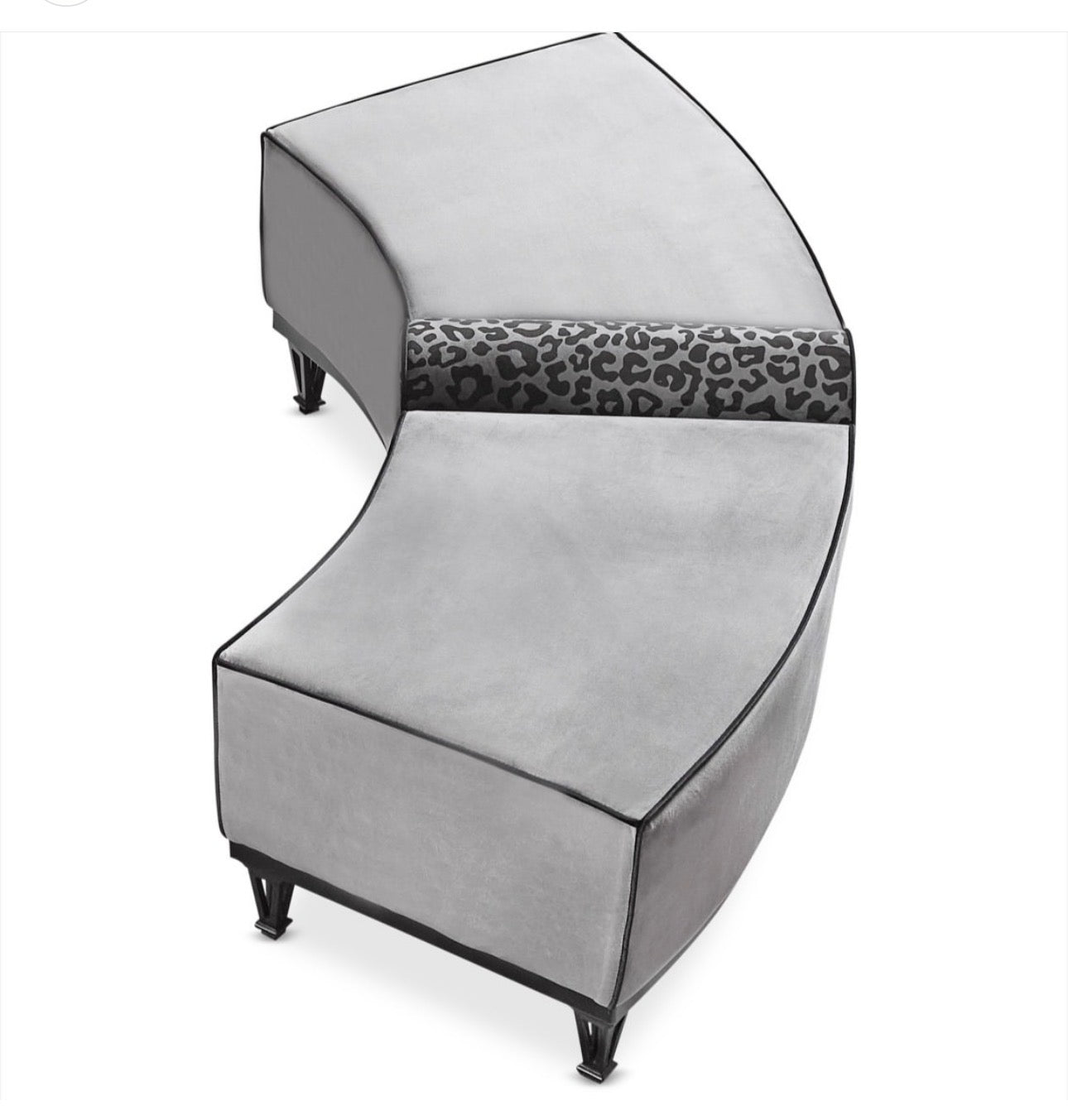 Panthera luxury furniture collection featuring statement sofa, sculptural coffee table, pedestal table, and modern shelving in dark finishes.