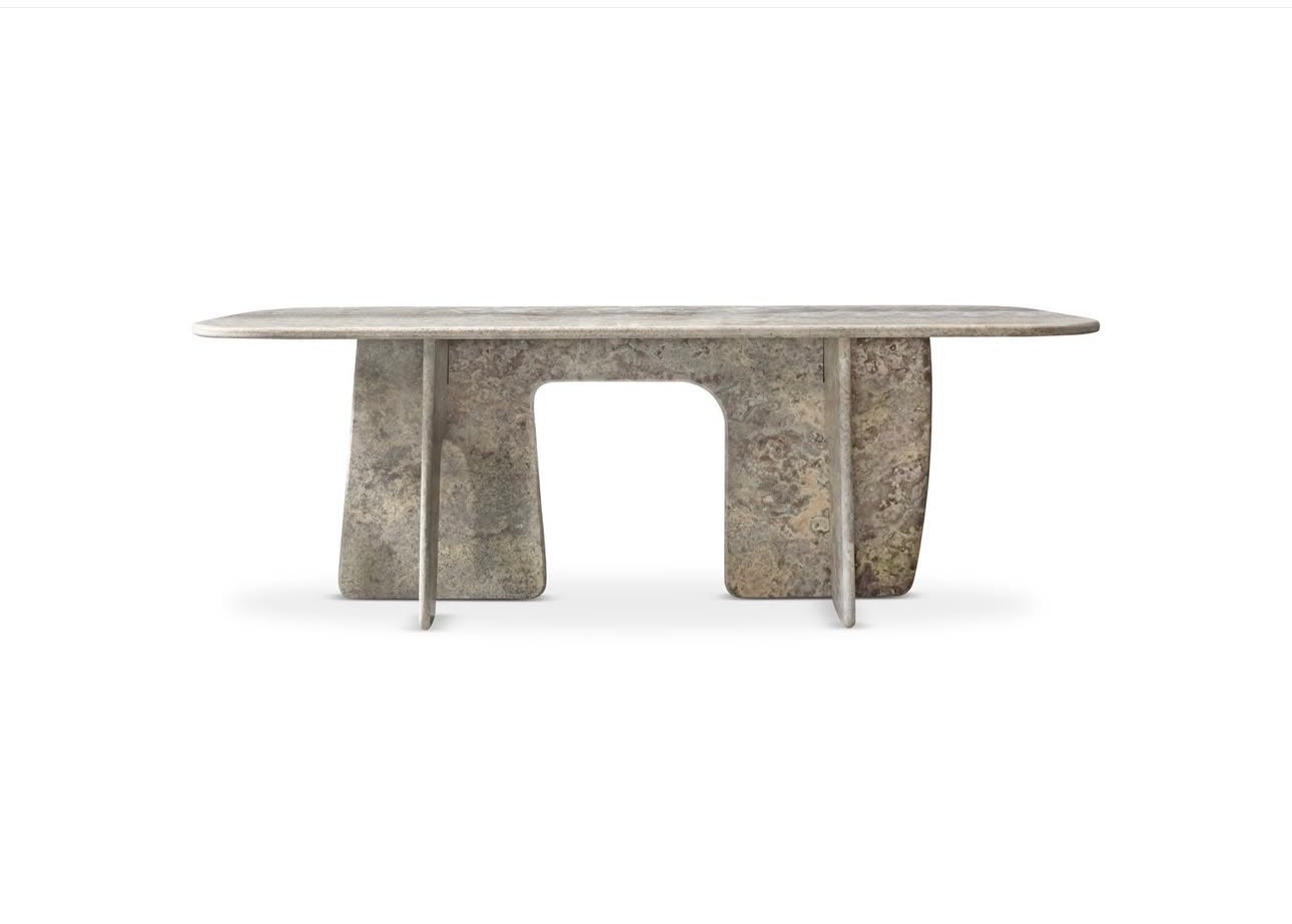 Panthera luxury furniture collection featuring statement sofa, sculptural coffee table, pedestal table, and modern shelving in dark finishes.