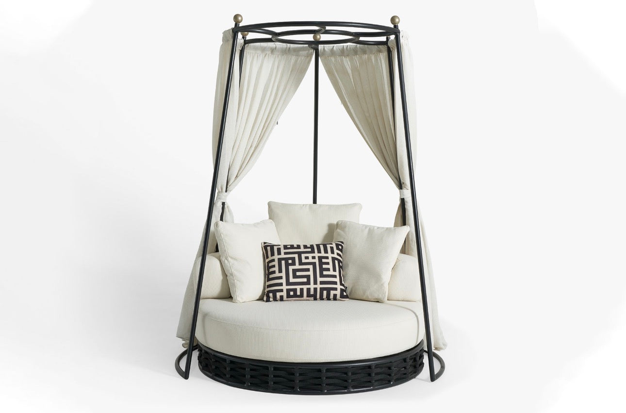 Sanctuarie luxury canopy lounge chair with draped fabric and deep cushioned seating